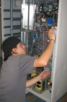 Oscar pulling parts from Liebert Tie Cabinet - Static Switch